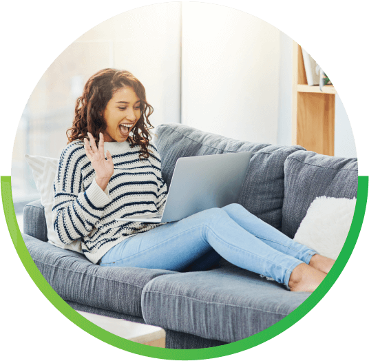 Girl on couch Happy with laptop