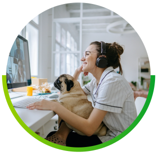 woman and small dog video calling at computer with stable fiber internet connection